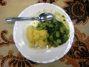 ugali served with lima beans with spinach and peanut sauce